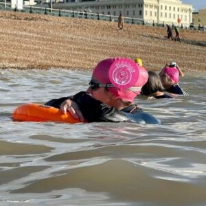 pink long hair swim hat with new logo superimposed